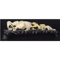 Elephant fighting lions, old ivory sculpture