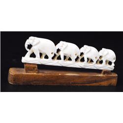 Elephants walking in a line, old ivory carving