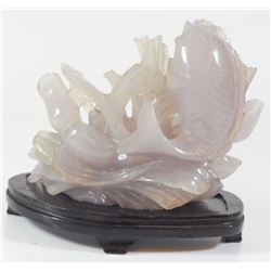 Fish swimming in the sea, old amethyst carving