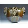 Image 1 : A late 19th century jardinière glazed in Burmantoft's style with streaky olive glazes over the roun.