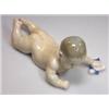 Image 1 : A Royal Copenhagen porcelain figure of a crawling baby with a sock in one hand, printed marks, SHX..