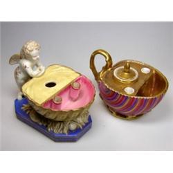 Two 19th century Paris shell inkwells, the inkwell and two pink quill holders overlooked by an amor.