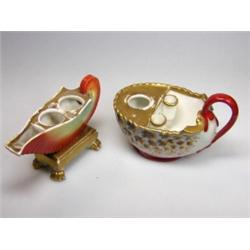 Two 19th century Paris porcelain shell inkwells, one in nautilus form supported on four gilt paw fe.