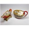 Image 1 : Two 19th century Paris porcelain shell inkwells, one in nautilus form supported on four gilt paw fe.