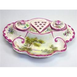 A Veuve Perrin style faience inkstand, the trough painted with a lake scene before two inkwells and.