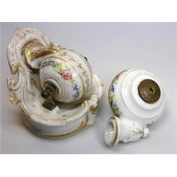 J L Encrier Bascule Paris, a snail shaped inkwell painted with flowers, 10cm wide together with a s.