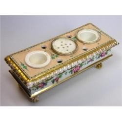 A mid 19th century Paris porcelain inkstand, the sides of the sarcophagus shape painted with flowers