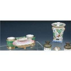 A mid 19th century Jacob Pettit inkstand with pink lipped shell pen trough before a waisted and rou.