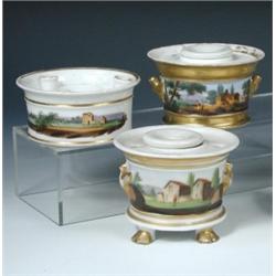 Three mid 19th century Paris landscape painted inkwells, each of circular shape with painted bands..