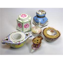 Six various inkwells, to include: two of shell shape, one painted with pink roses, another floral w.