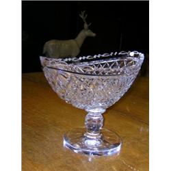 A late 20th century Waterford standing bowl, the navette shape diamond cut below the serrated rim,..