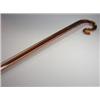 Image 1 : An early 20th century amber and clear glass walking stick of diamond section and with crook handle,.