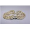 Image 1 : A double string of graduated cultured pearls (149) with an 18ct white gold and diamond clasp  £330-.