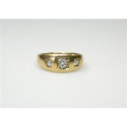 An 18ct gold diamond ring set with three old cut stones  £500-800...