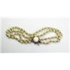 Image 1 : A double string cultured pearl necklace with gold bead spacers and a 14ct gold clasp set with pale..