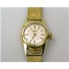 Image 1 : A lady's 18ct gold cased wristwatch by Longines with circular silvered dial with gold baton numeral.