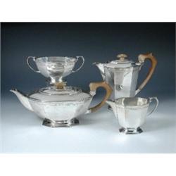 A silver four piece teaset by the Goldsmiths' and Silversmiths' Co Ltd, Sheffield 1951, comprising:.