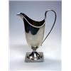 Image 1 : A Victorian silver cream jug by Nathan and Hayes, Birmingham 1892, of helmet shape below a punch be.