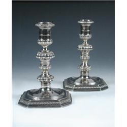 A pair of William and Mary cast silver candlesticks by Pierre Harache I, London 1692 each raised on.