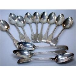 A matched set of twelve George IV/ William IV and Victorian silver fiddle pattern table spoons incl.