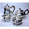 Image 1 : A matched silver four piece teaset by Edward Barnard & Sons, comprising: a teapot of plain compress.