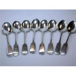 A set of eight Scottish silver fiddle pattern dessert spoons, maker MC&Co, Edinburgh 1868, crested,.