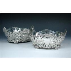 A pair of Edwardian silver cake or bread baskets by D & J Welby, London 1903, each of compressed ov.