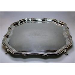 A silver salver, maker HEB/FEB, Chester 1924, of rectangular shape with rounded moulded edges, rais.
