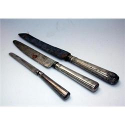 A set of fourteen late 18th/early 19th century Irish silver handled table knives with steel blades,.