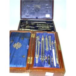 Two Thornton of Manchester geometry sets, the earlier in red leatherette case, 19cm wide and that d.