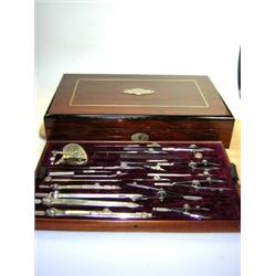 An early 20th century Kern Aarau rosewood cased geometry set, the wine red velvet lined tray filled.