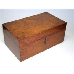 A late 19th century burr yew wood tea caddy, a diamond shaped ebony key escutcheon below the rectan.