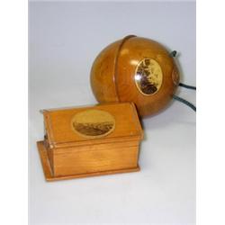 A mid Victorian Mauchline watch holder, the roof of the hut shaped box applied with photographic ov.