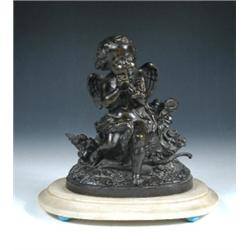 A 19th century bronze figure of Cupid his hands tied by a ribbon as he sits amongst flowers on a tr.