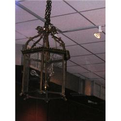 A 20th century glazed brass hall lantern, the three electric sockets supported on a column joined t.