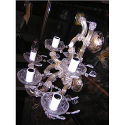 Four cut glass wall lights, each with five scrolling branches in two tiers hung with glass beads and