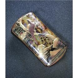 A late 19th century Japanese lacquered 'tortoiseshell' cigar case decorated in tones of gold, black.