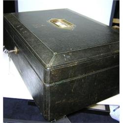 A George V Peck and Son dispatch box, the Royal cipher and initials SMP gilt before the brass handl.