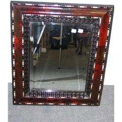 A Baroque style Spanish tortoiseshell framed mirror, the bevelled rectangular plate within wavy ban.