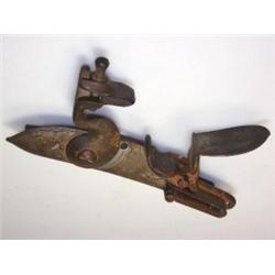 A flintlock musket mechanism, dated 1757 and inscribed Wilson behind the cock, the Royal cipher beh.