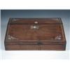 Image 1 : A mid 19th century rosewood writing slope, the hinged fall sloping away from a lid covering compart.