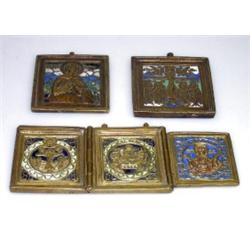 Three 19th century Russian enamelled travelling icons, the triptych of brass depicting scenes from..