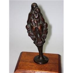 Georg Wrba (1872-1939), a bronze group of mother and children, she sits naked but for a shawl over..