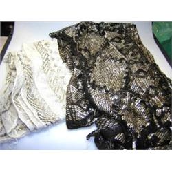 Two silver thread and muslin stoles, one black and interwoven with fine silver tape, 196 x 70cm, th.
