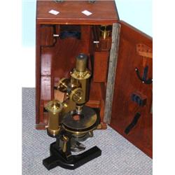 Carl Zeiss Jena 28480, a 20th century mahogany cased microscope with two objectives above a calibra.