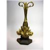 Image 1 : A late Victorian brass door stop cast with a fleur de lys above the facetted iron base, the stem di.