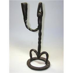 A 19th century wrought iron rushlight candle holder, the candle holder arm of the scissor action to.