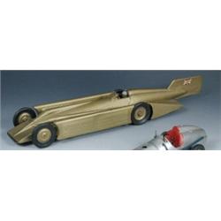 A Kingsbury clockwork model of the Golden Arrow record car, the pressed metal body with gold finish.