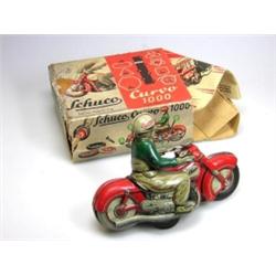 A Schuco Curvo 1000 clockwork motorcyclist, fair condition in rather worn box with instructions £10.