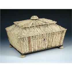 An early Victorian Vizagapatam stags horn workbox, the exterior of the sarcophagus shape nailed wit.